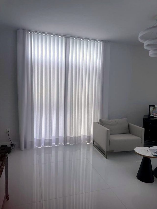 Handed over before the furniture. An empty room is the hardest place to hang drapery, because there is no furniture to distract from a hem that is off.